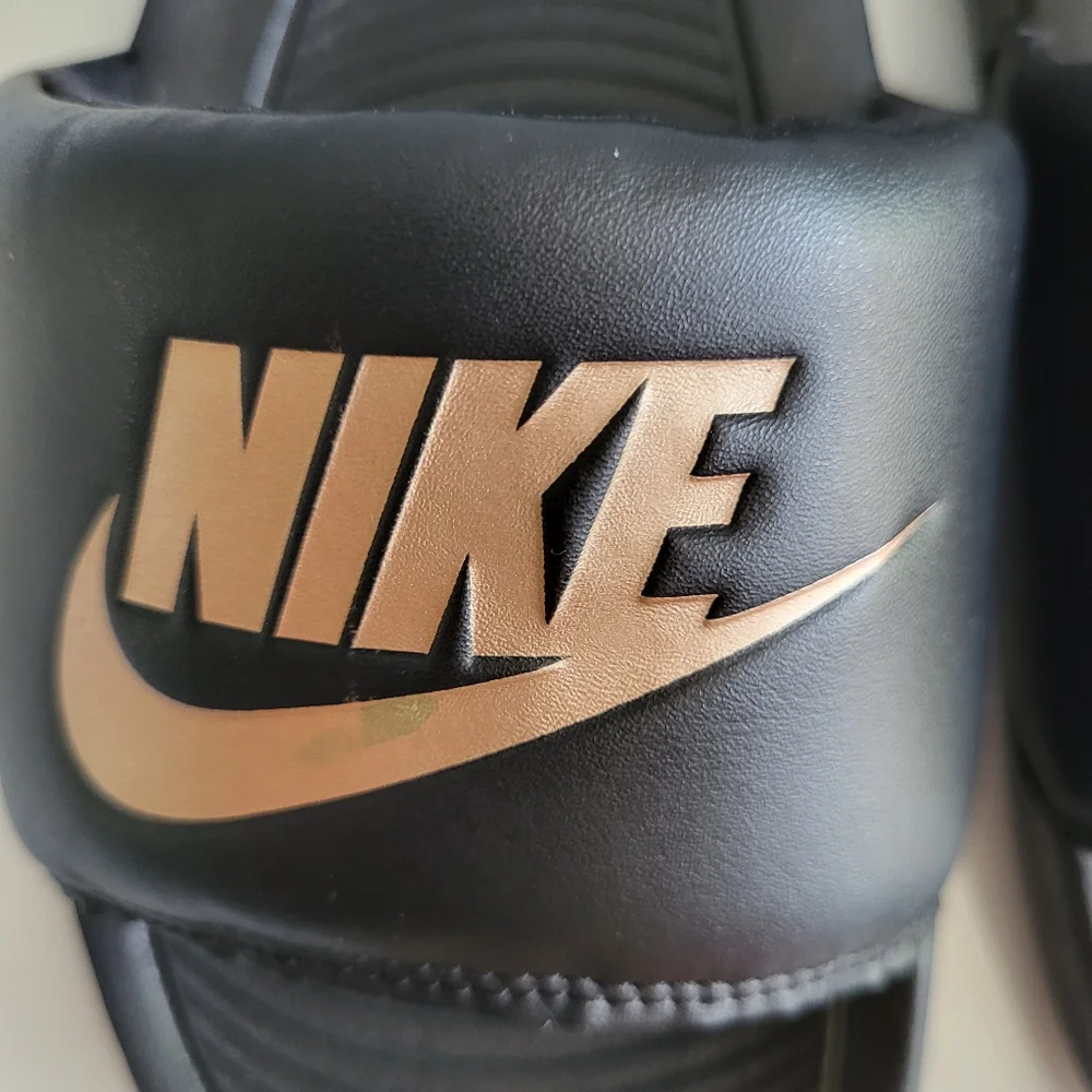 Nike Black Slides with Gold Logo